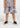 This is a young Boy wearing the Haus Of Jr kids Mauve shorts