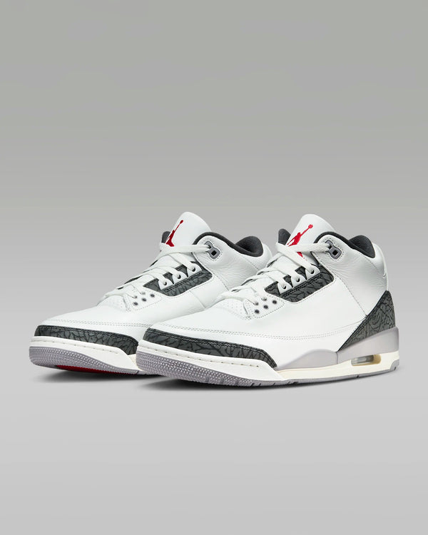 Air Jordan 3 Retro 'Cement Grey' with white leather, grey elephant print accents, crimson Jumpman logos, and a grey/off-white midsole with visible Air unit in the heel.