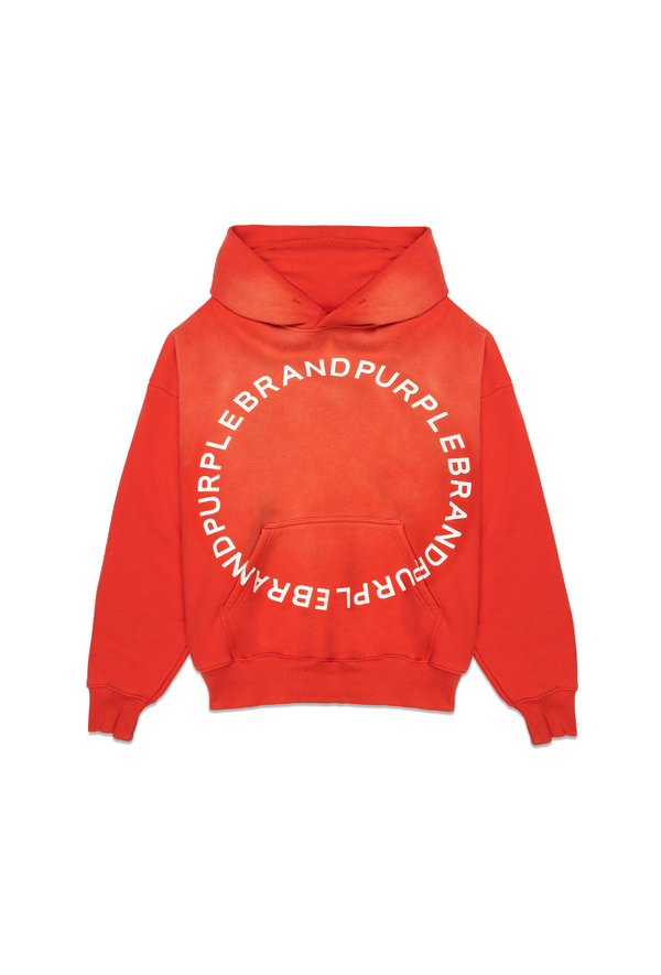 Red heavyweight fleece hoodie by Purple Brand featuring an oversized fit, circular block logo lettering, dropped shoulders, a large kangaroo pocket, and ribbed cuffs and hem. The hoodie has a center front silicone print and is enzyme washed for a unique finish.