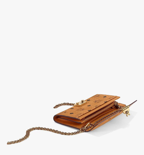 Mcm (cognac small Patrick crossbody wallet in visetos)