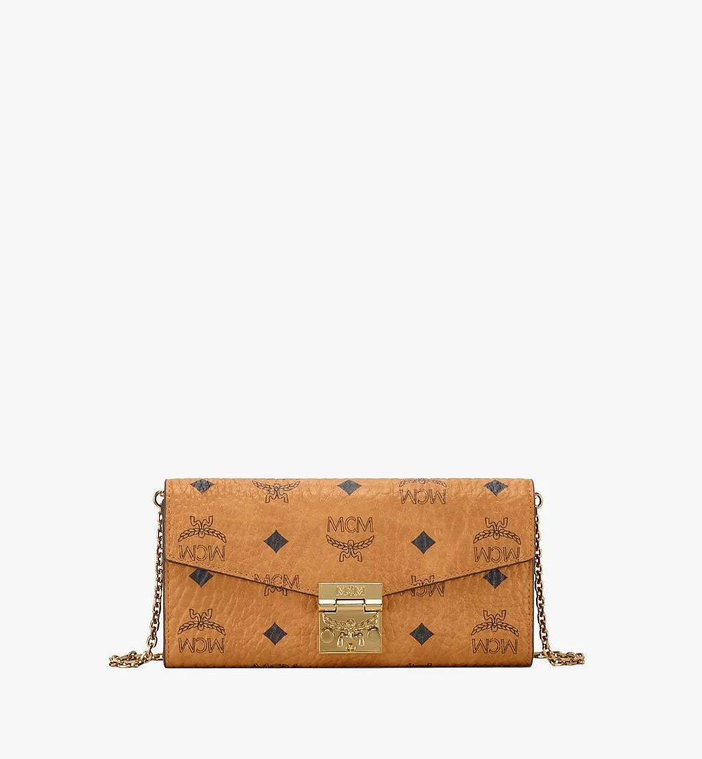 Mcm (cognac small Patrick crossbody wallet in visetos)